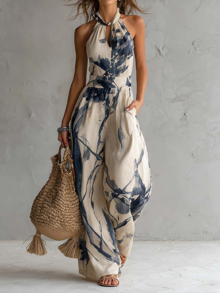 Jumpsuit with American neckline and washed ink print, featuring pockets and wide leg
