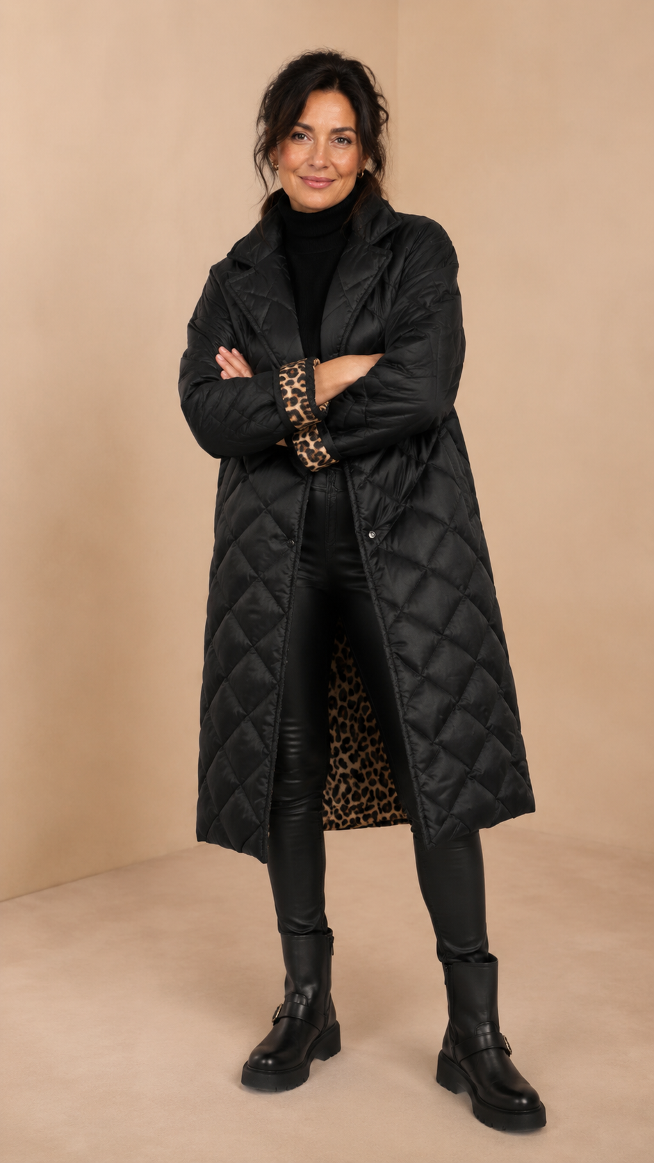 Black reversible quilted jacket, open front shows leopard print lining and long sleeves