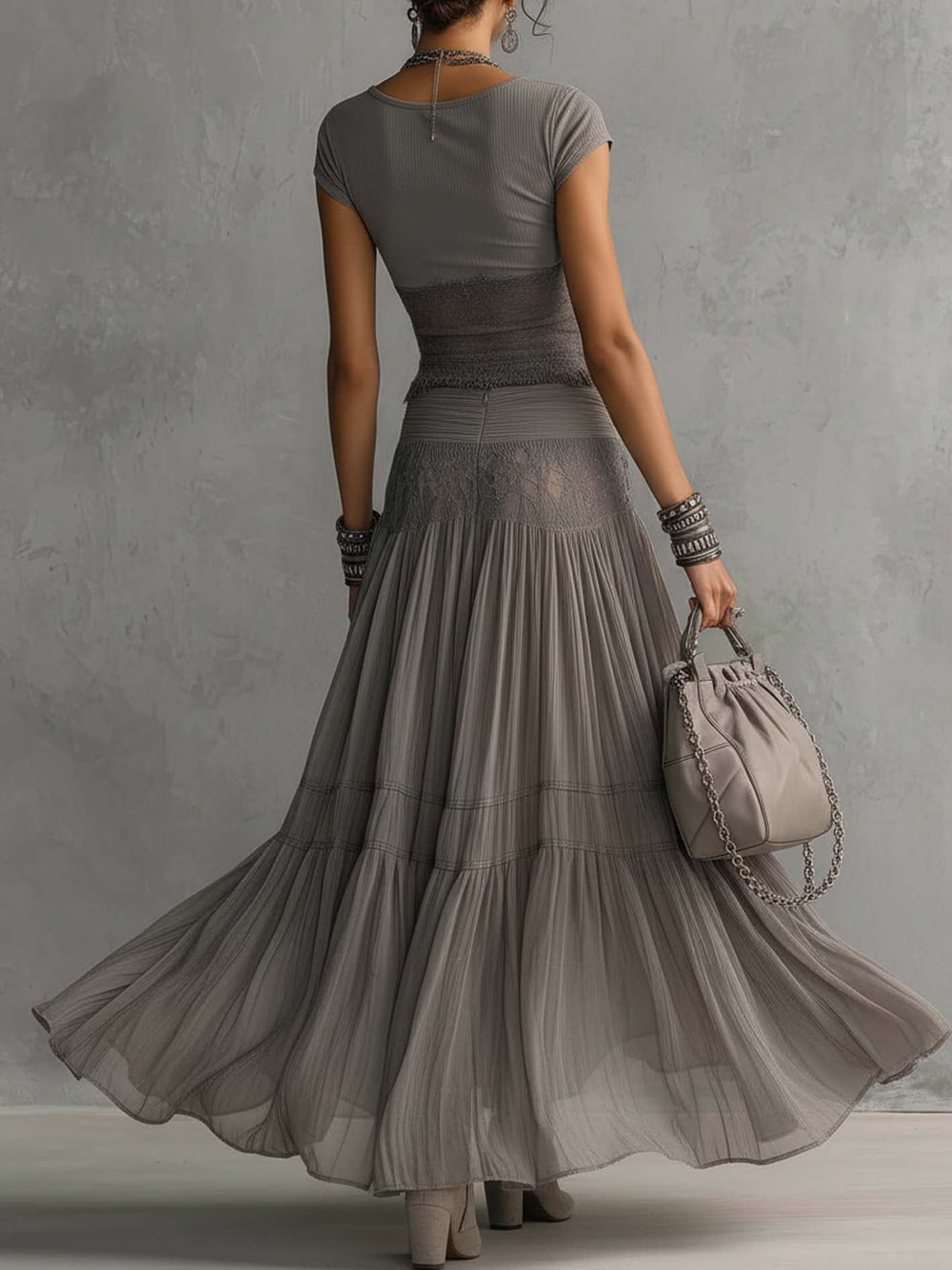 Grey fitted cap-sleeve top and pleated sheer maxi skirt, back view