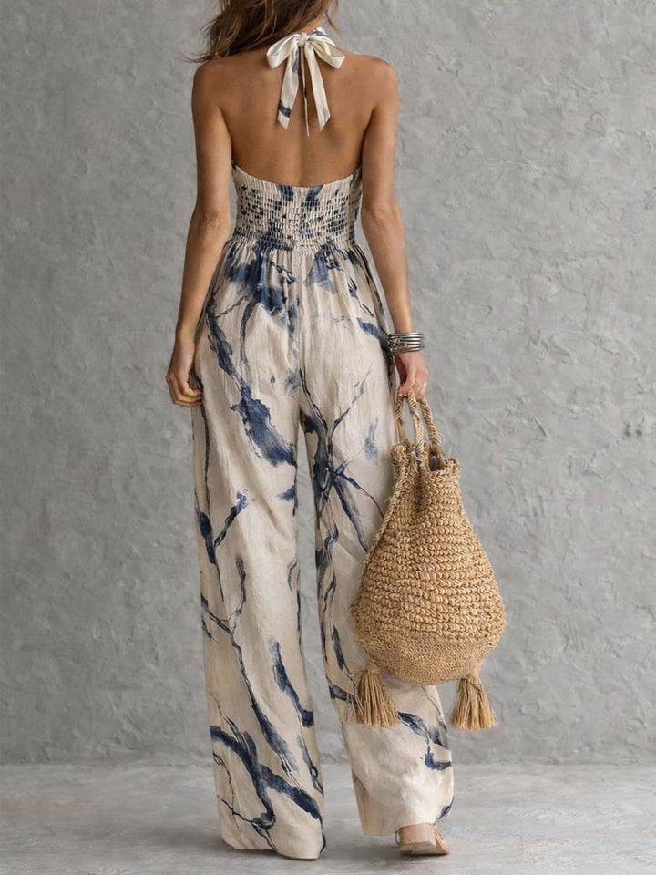 Jumpsuit with American neckline and washed ink print, featuring pockets and wide leg