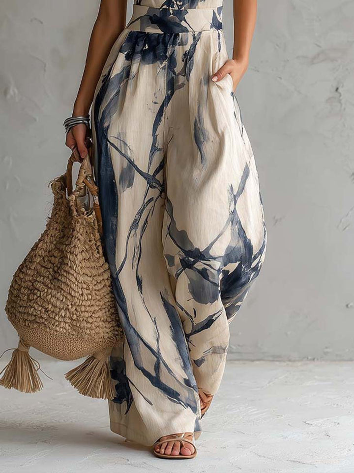 Jumpsuit with American neckline and washed ink print, featuring pockets and wide leg