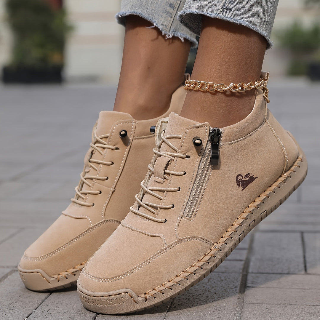 Tan lace-up comfort shoes with side zipper and gold chain ankle strap