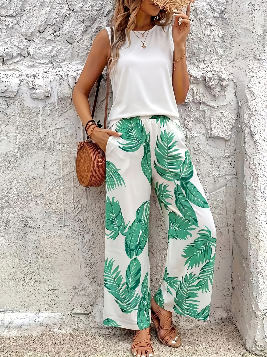 Two-piece botanical wide-leg set with sleeveless top, white and green leaf print pants
