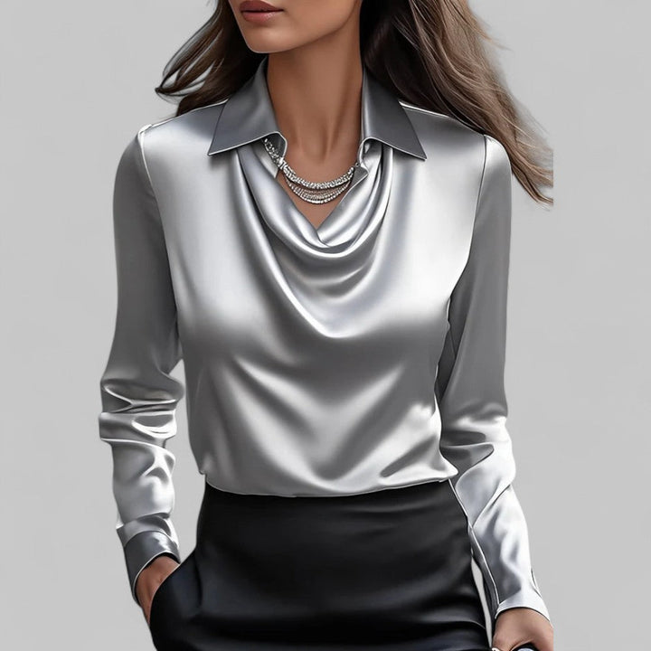 Satin draped cowl-neck blouse in light gray-blue with long sleeves and collar.