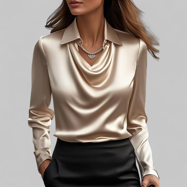 Cream satin draped cowl-neck blouse with long sleeves and pointed collar.