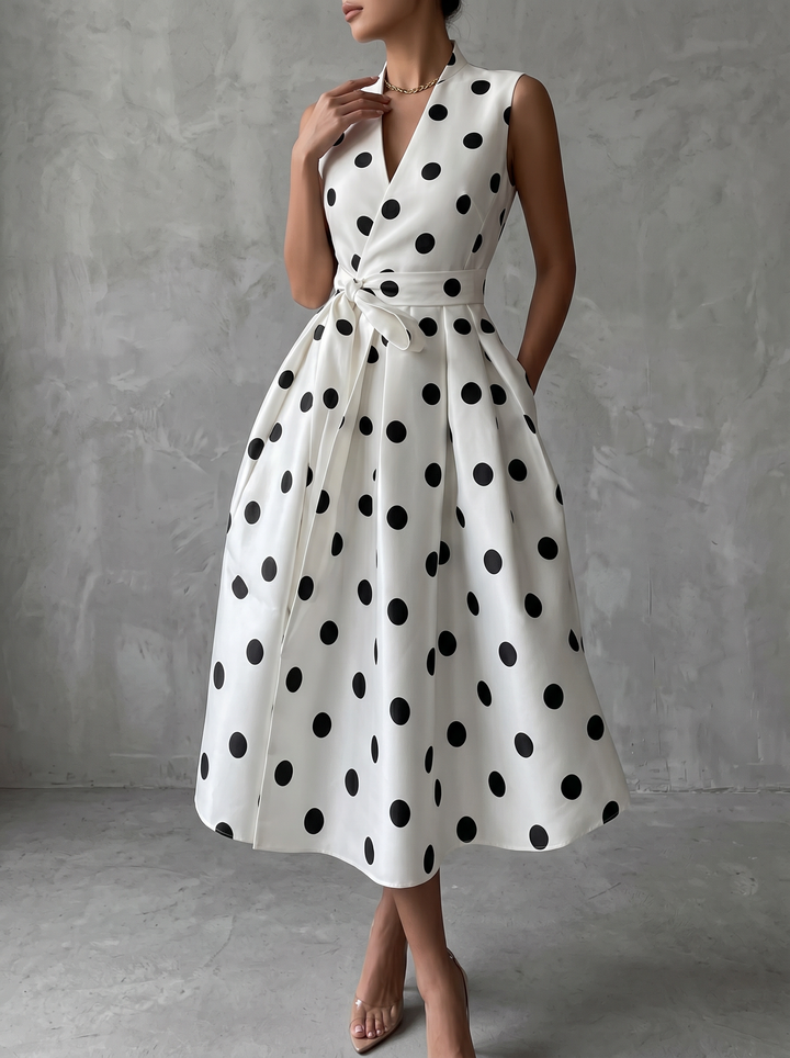 Black and white classic midi dress with polka dots and French sleeves