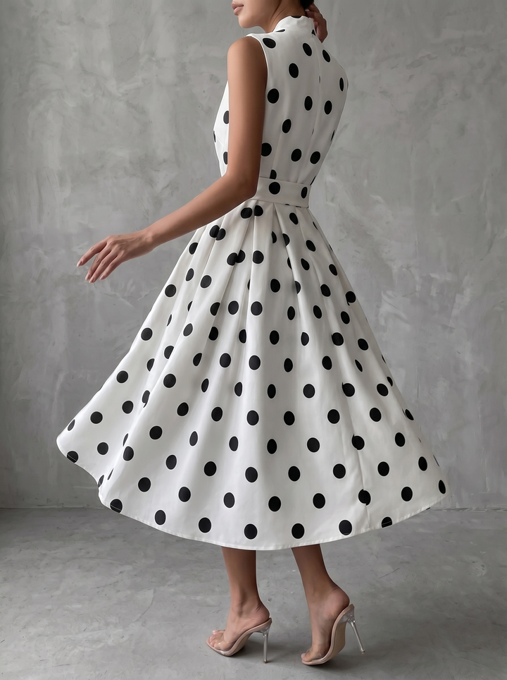 Black and white classic midi dress with polka dots and French sleeves