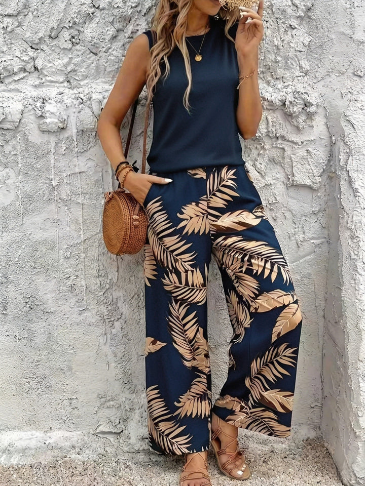 Two-piece botanical wide-leg set with sleeveless top, navy and tan leaf print trousers