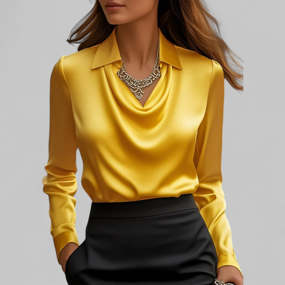 Yellow satin draped cowl-neck blouse with long sleeves and pointed collar.
