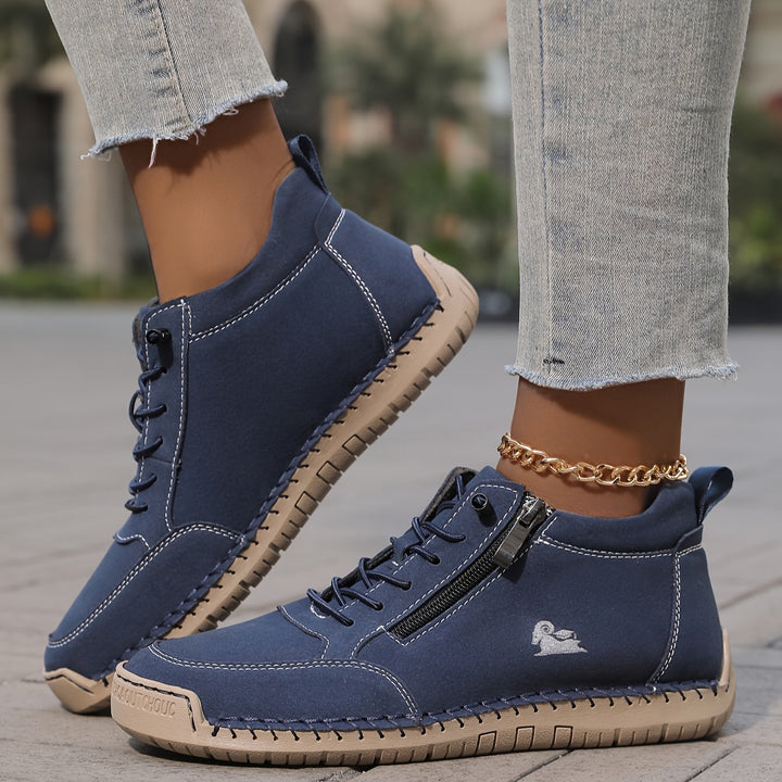 Navy lace-up comfort shoes with side zipper and gold chain ankle strap