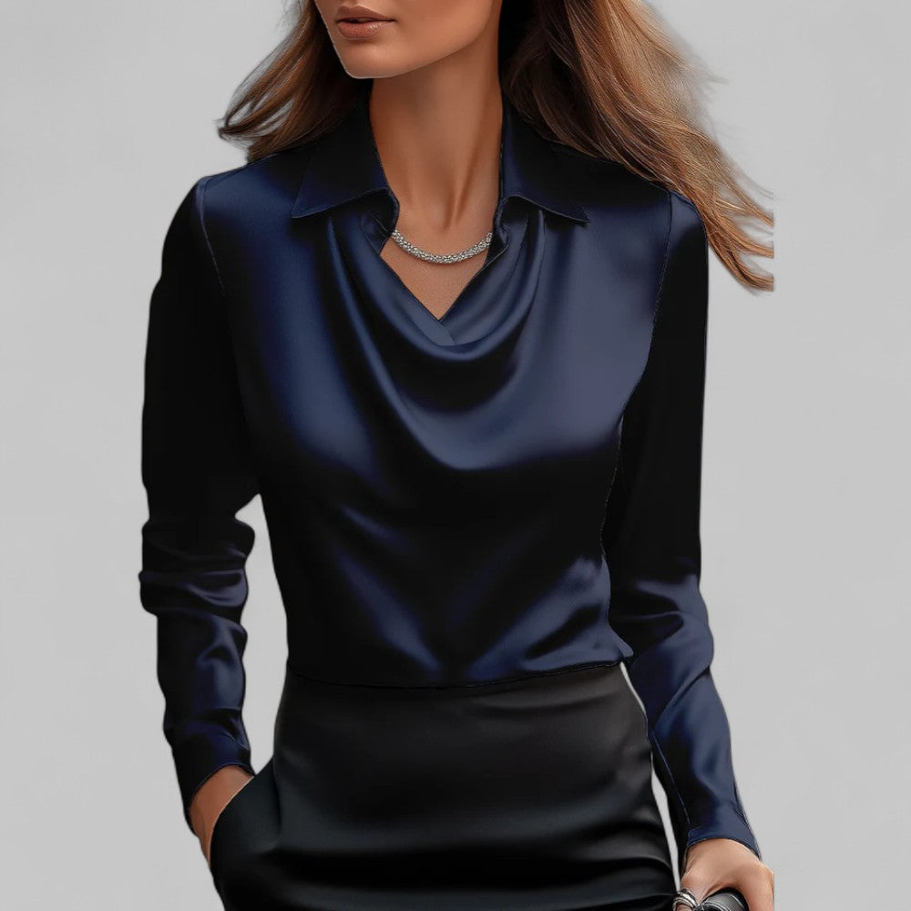Navy satin draped cowl-neck blouse with long sleeves and pointed collar.