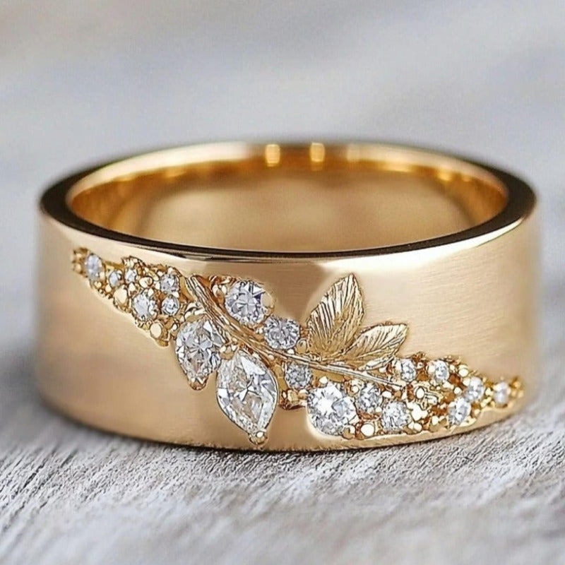 Gold-tone leaf zirconia inlay ring with marquise and round stones, full band view