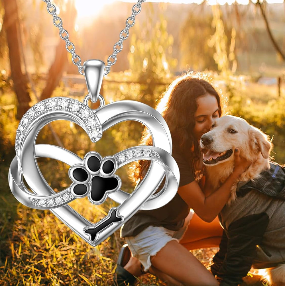 Sterling silver heart pendant necklace with paw print centerpiece and sparkling zirconia stones