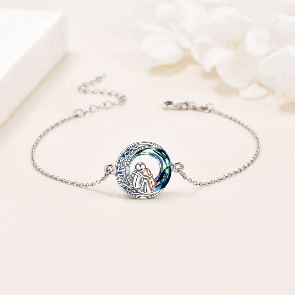 Sterling silver adjustable dog charm bracelet with round blue enamel dog charm centerpiece