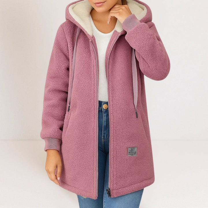 Pink cozy fleece hooded jacket with full zipper, drawstring pulls, and side pockets