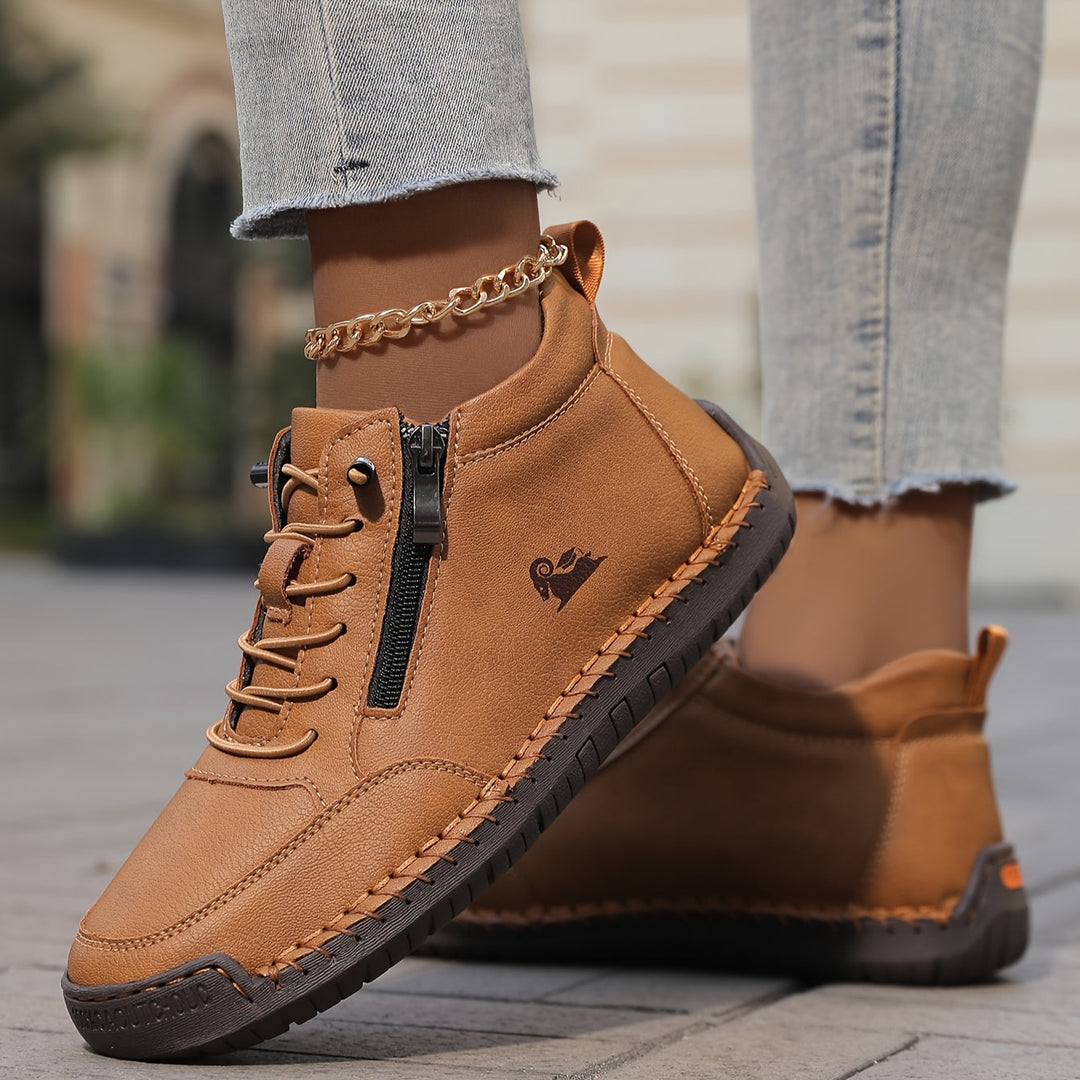 Tan lace-up comfort shoes with side zipper and gold chain ankle strap