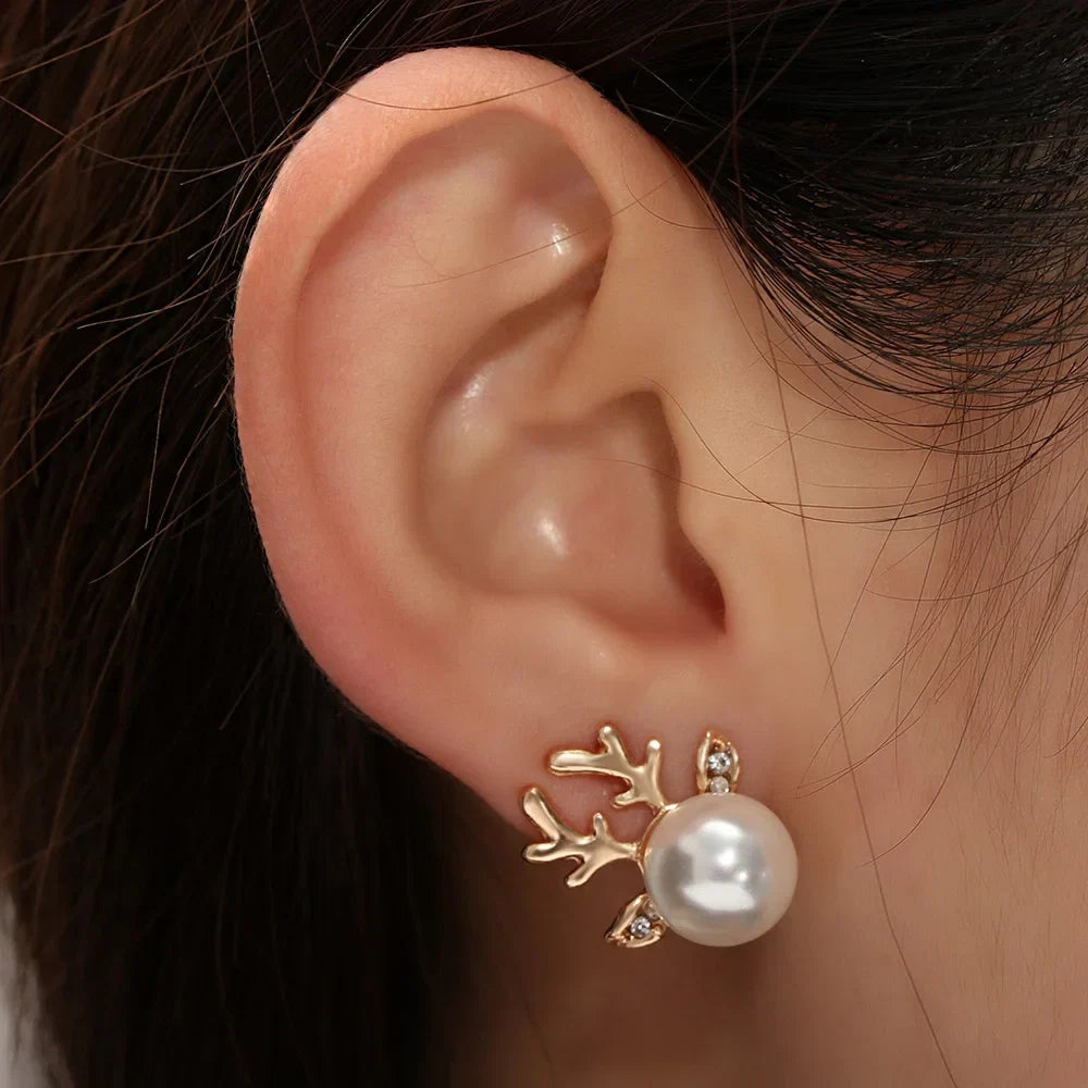 Gold reindeer antler stud earrings with white pearl and crystal details