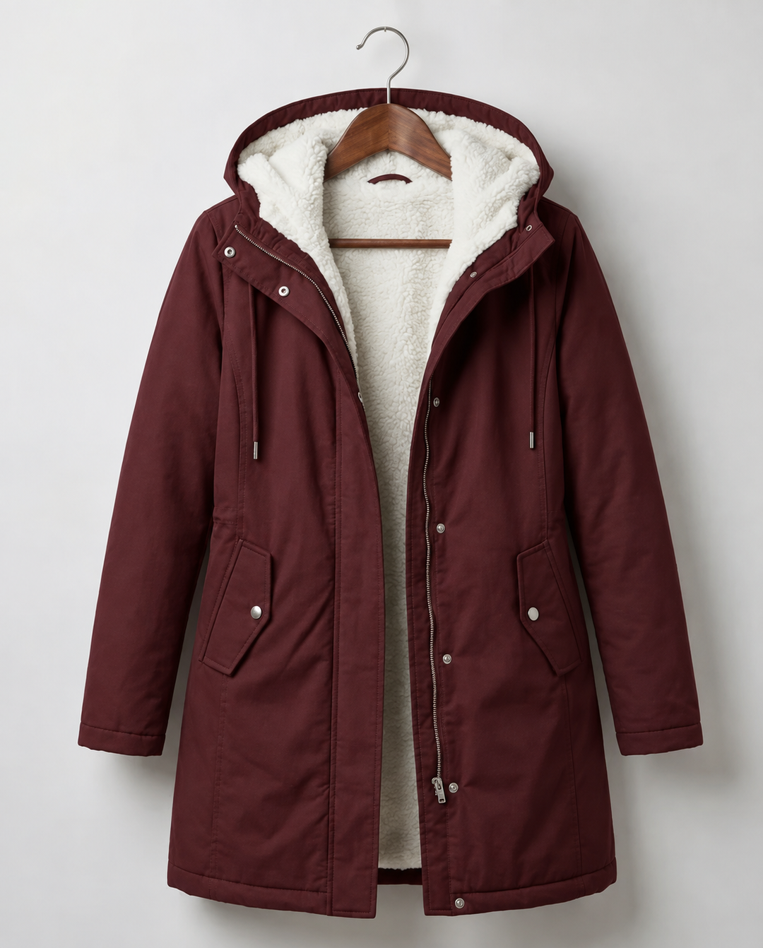 Berry red waterproof parka jacket with hood, sherpa lining, front zip, and side pockets.