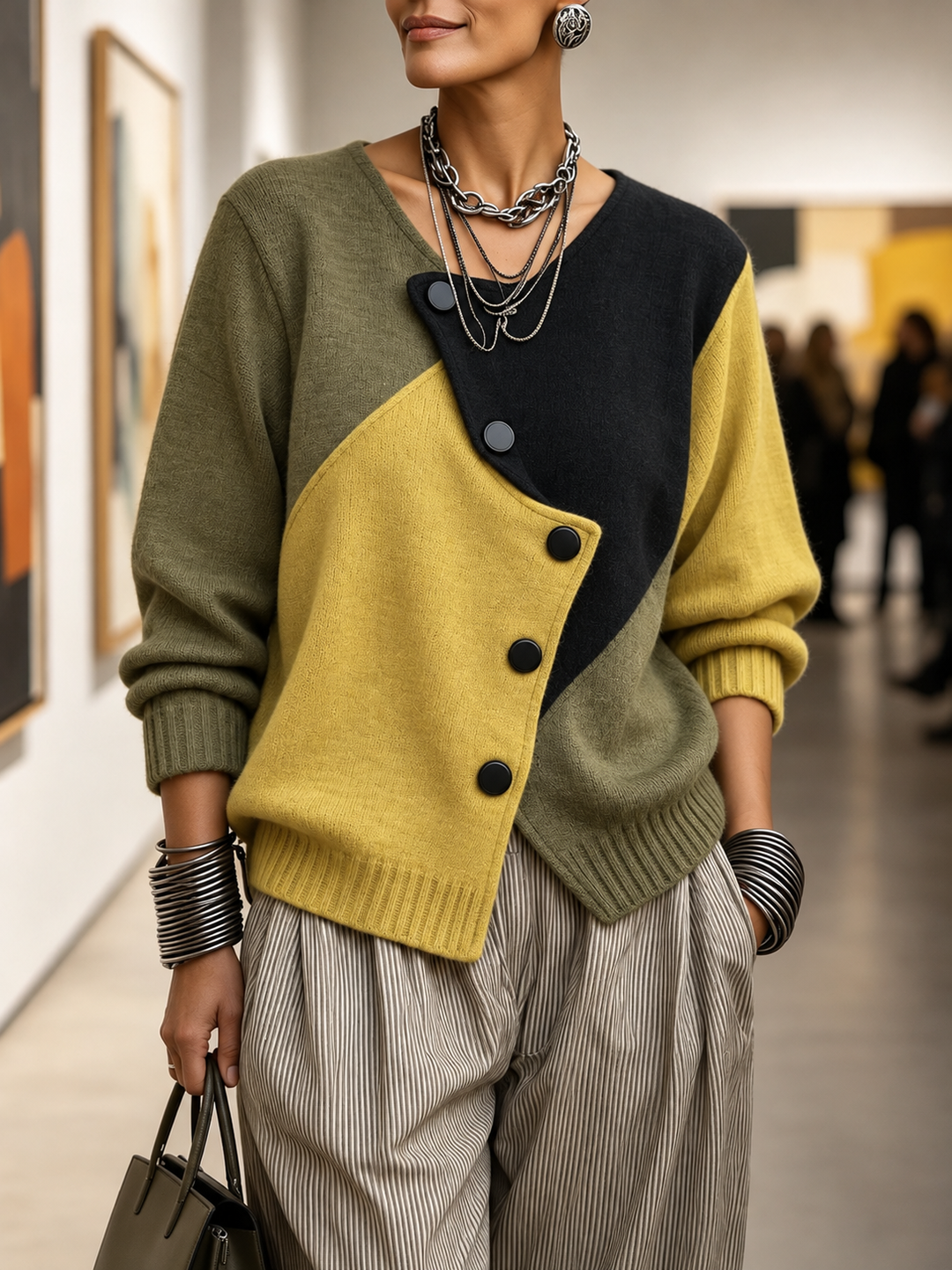 Colourblock asymmetric sweater with black yoke, olive sleeves, mustard diagonal panel