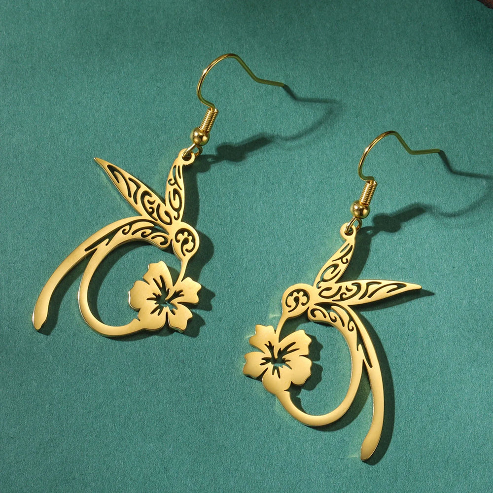 Gold bird-and-flower drop earrings with star and crescent cutout design