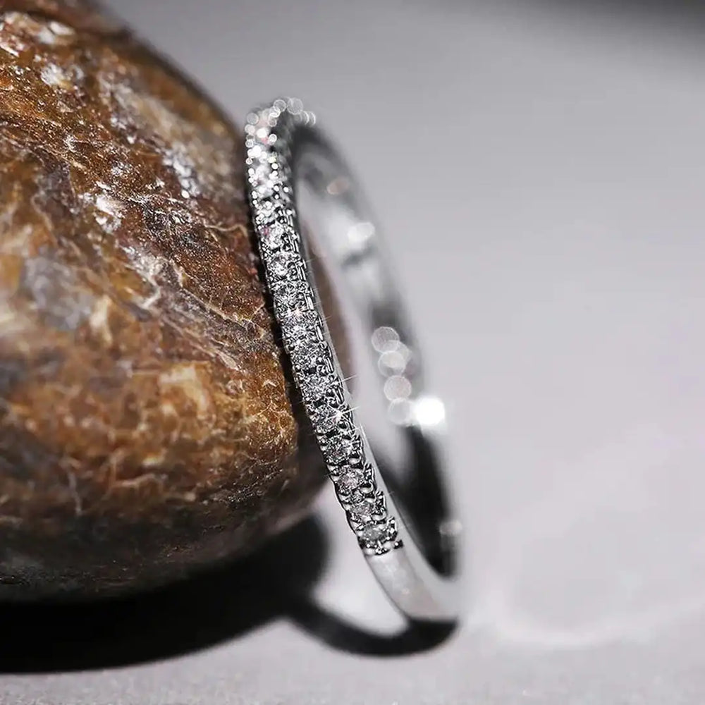 White gold zirconia minimalist eternity band ring with sparkling pave stones