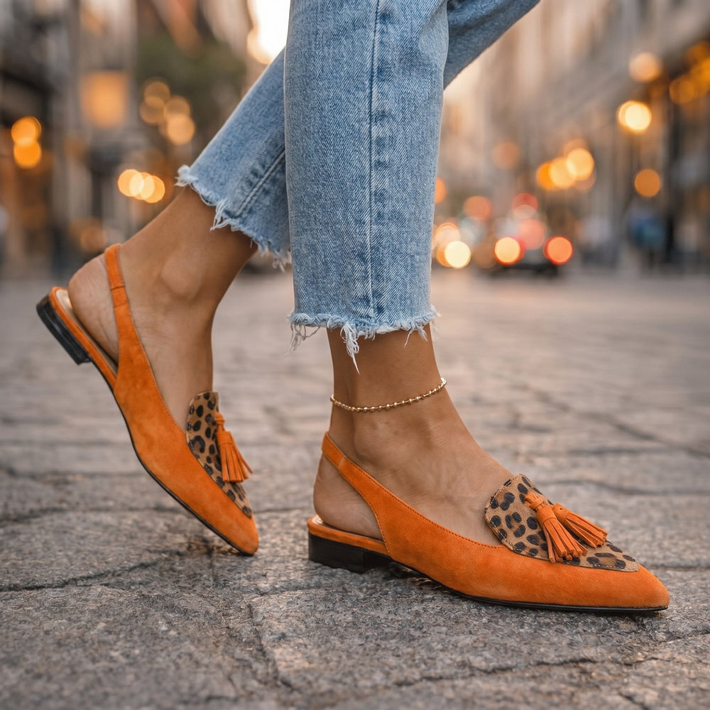 Orange suede tassel sandals with leopard-print insets and ankle strap, side view