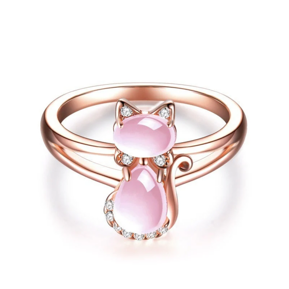Rose gold cat ring with two pink oval gemstones and clear stone accents, front view