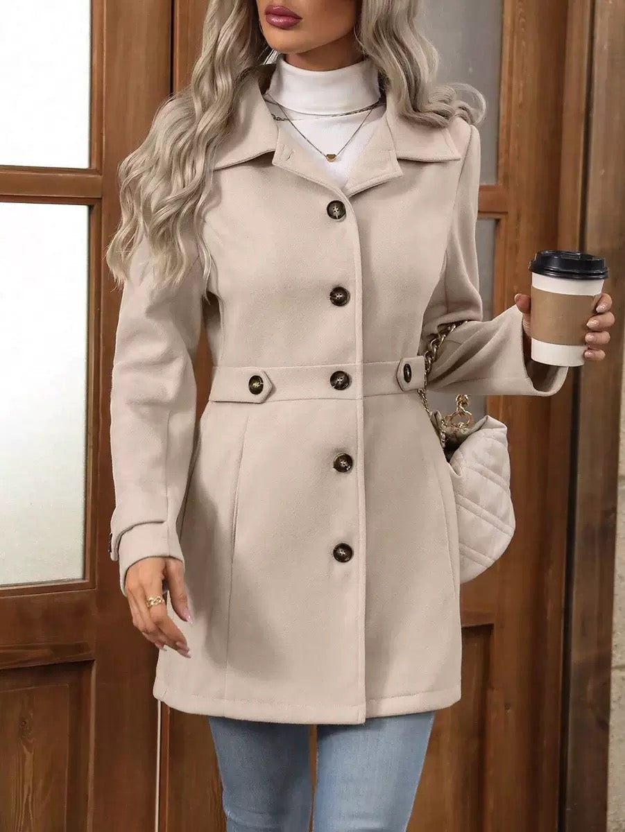 Beige belted long coat with notched collar, double-breasted buttons, and side pockets