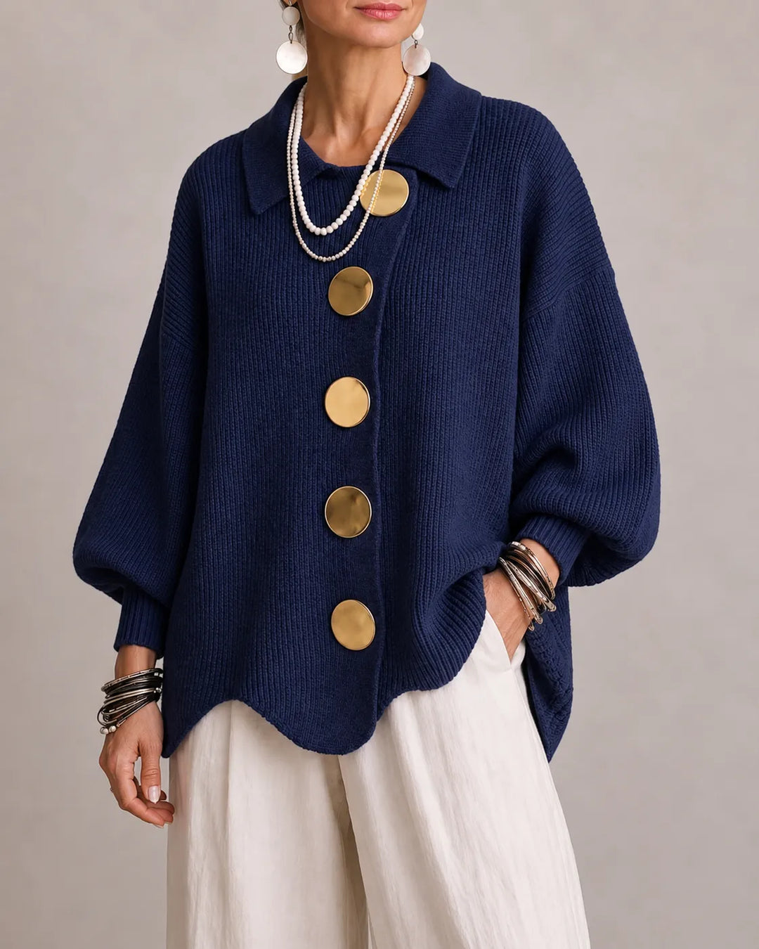 Navy oversized knit sweater with collared neckline and gold round button front