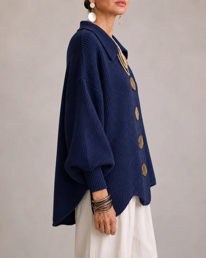 Navy oversized knit sweater with wide drop-shoulder sleeves and gold button detail
