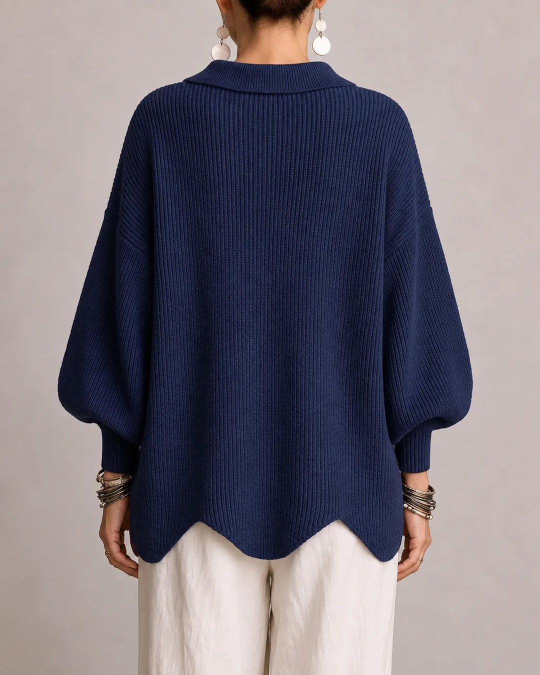 Navy oversized knit sweater back view with ribbed texture and wide sleeves