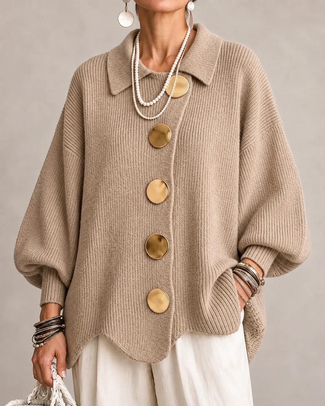 Beige oversized knit sweater with shirt collar and gold round button front