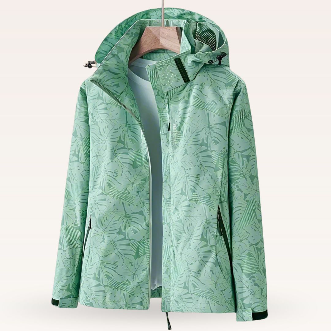 Women’s waterproof hooded jacket in green with leaf print, full zip and side pockets