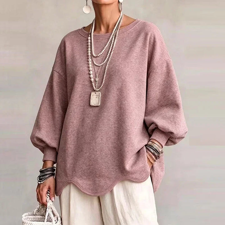 Pink oversized sweatshirt with wavy hem and loose long sleeves