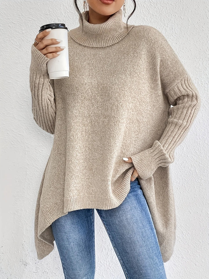 Beige high-neck asymmetric hem knit sweater with long ribbed sleeves and angled hem