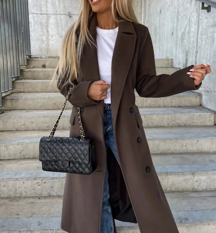 Dark brown long sleeve trench coat with notched lapels, double-breasted buttons, belt
