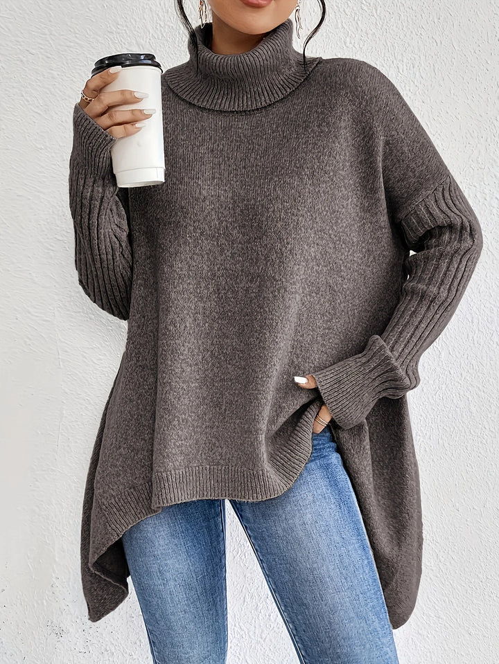 Charcoal high-neck asymmetric hem knit sweater with long ribbed sleeves and draped back