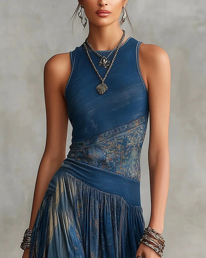 Blue sleeveless boho maxi dress with aztec-style band at waist and gathered tier skirt