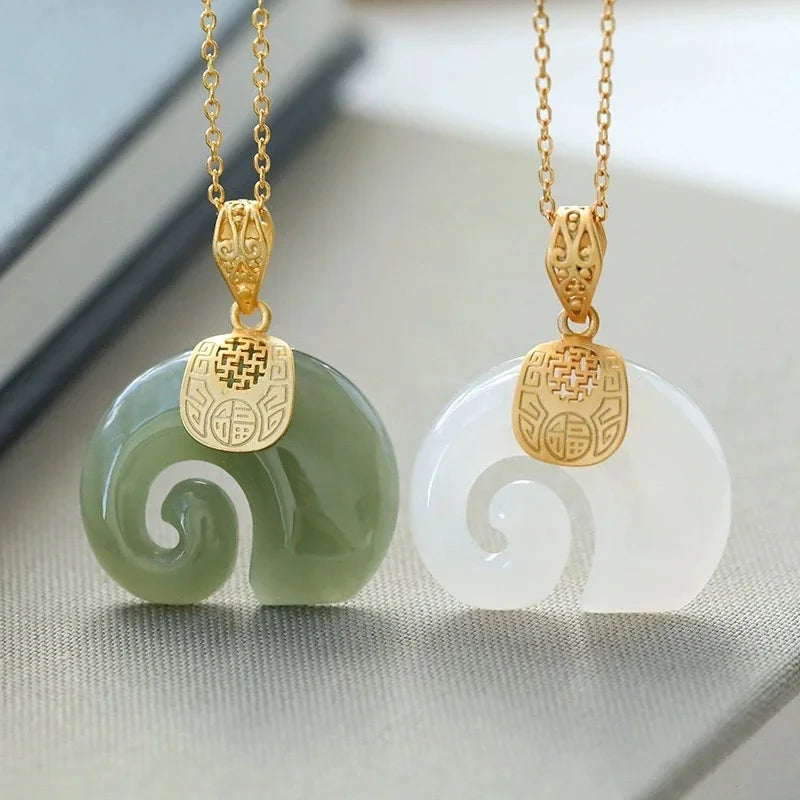 Pair of jade elephant pendant necklaces with gold-plated chain, green and white