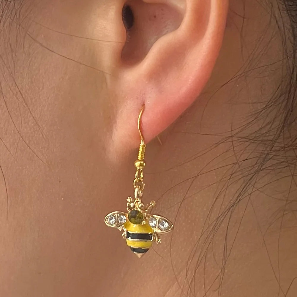 Gold-tone bee crystal drop earring with amber body and clear wing details