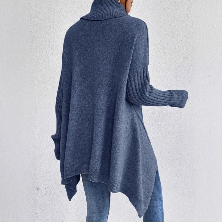 Blue high-neck asymmetric hem knit sweater, back view with draped long sleeves