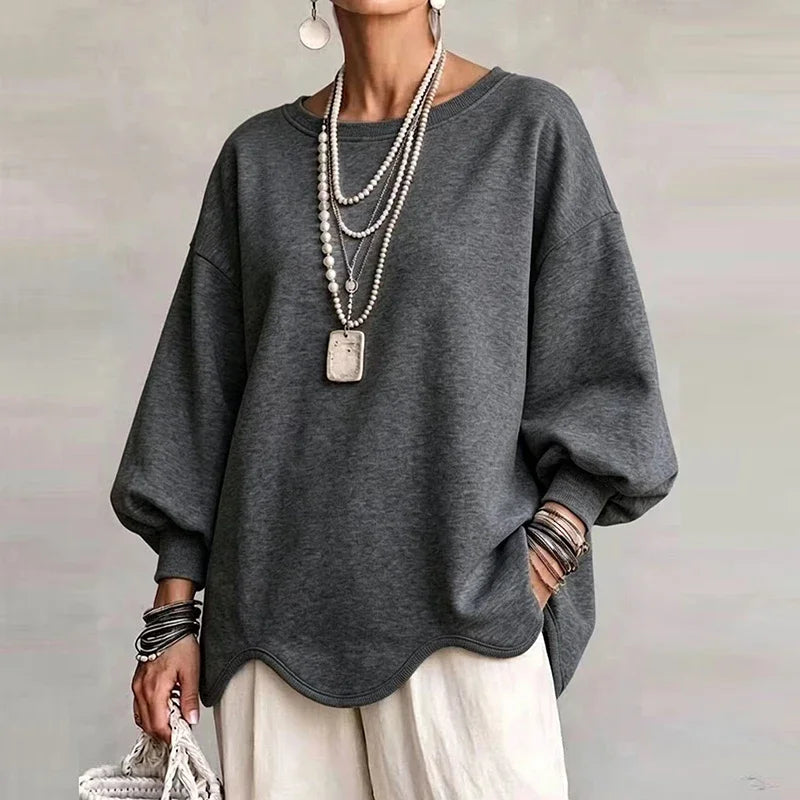 Grey oversized sweatshirt with wavy hem and long relaxed sleeves