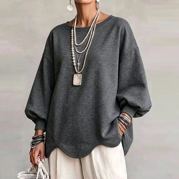 Grey oversized sweatshirt with wavy hem and long relaxed sleeves
