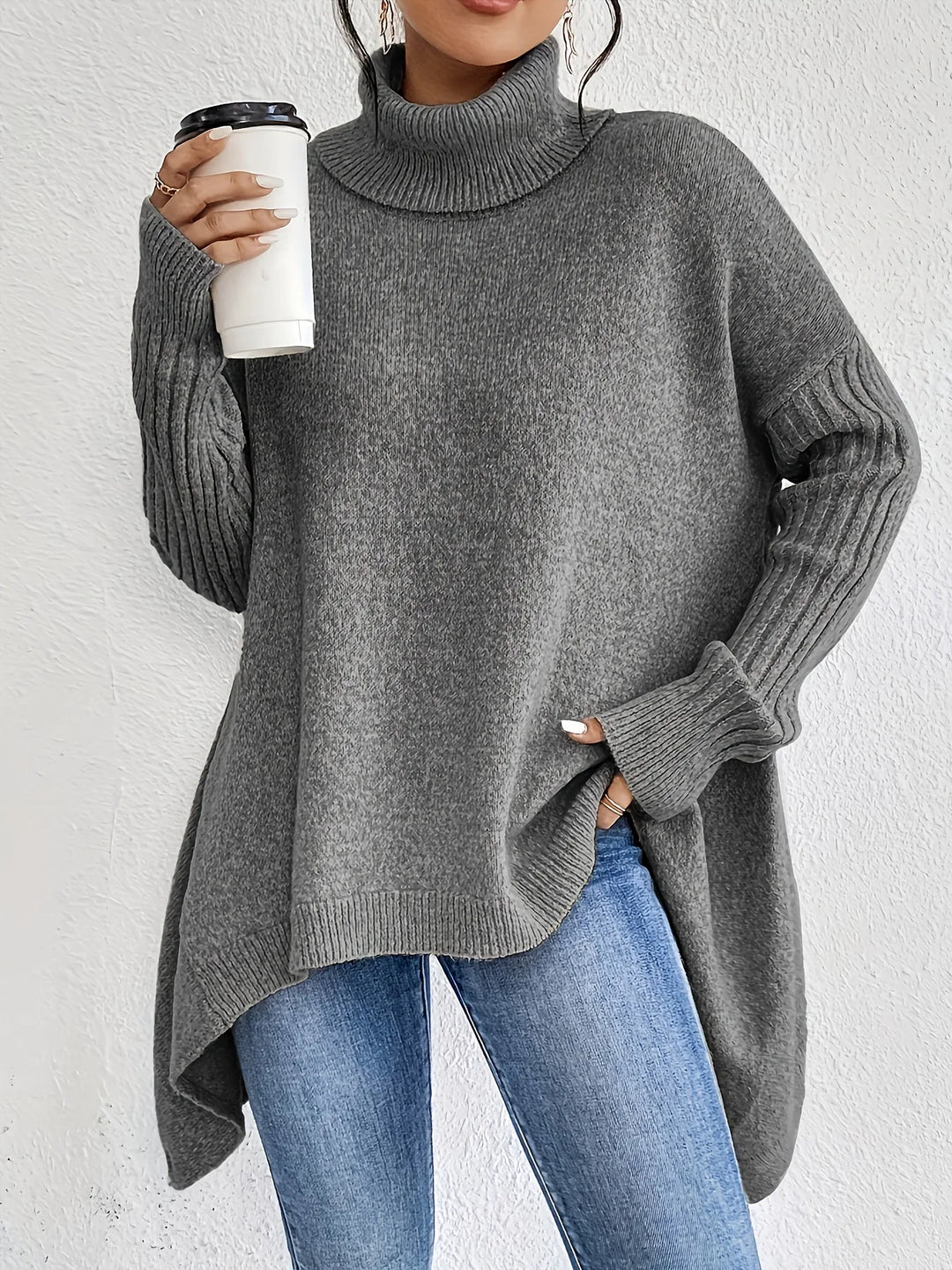 Grey high-neck asymmetric hem knit sweater with ribbed cuffs and draped side hem