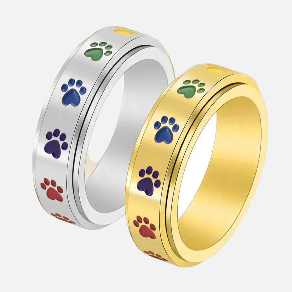 Stainless steel paw spinner ring duo in silver and gold with multicolor paw print inlays