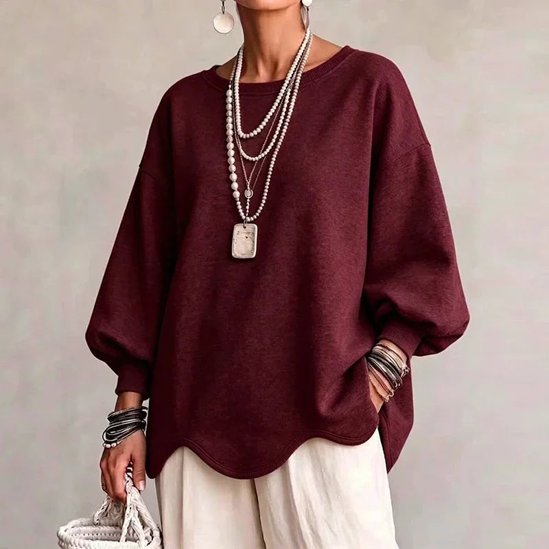 Burgundy oversized sweatshirt with wavy hem and roomy long sleeves