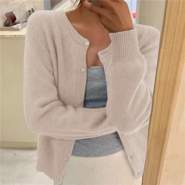 Beige soft-knit cardigan with button front, round neck, long sleeves, ribbed cuffs and hem