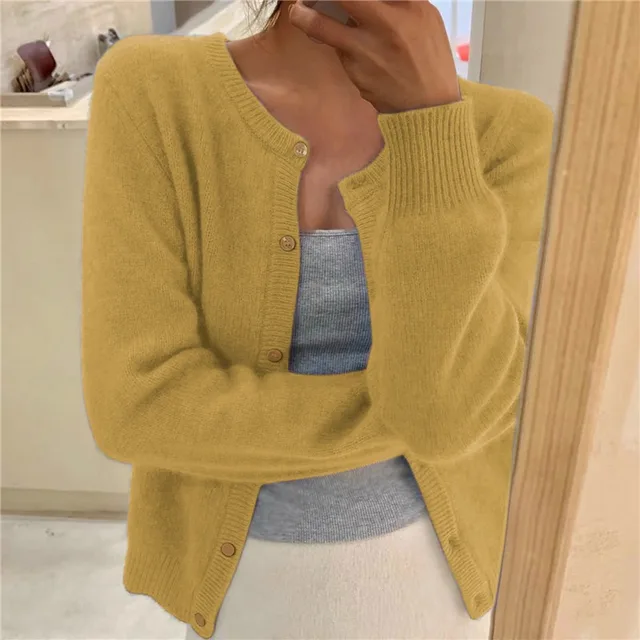 Yellow soft-knit cardigan with button front, round neck, long sleeves, ribbed cuffs and hem