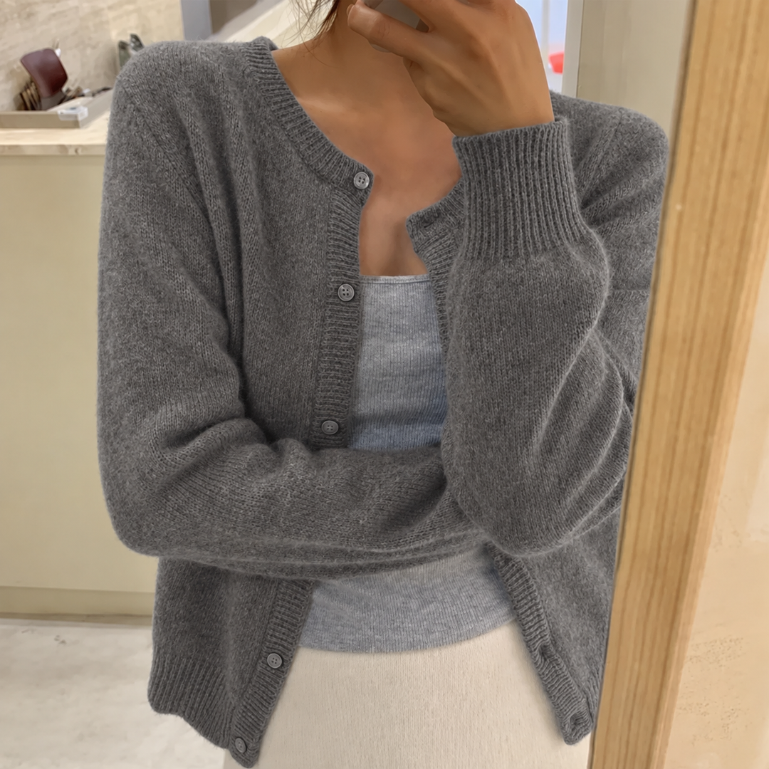 Grey soft-knit cardigan with button front, round neck, long sleeves, ribbed cuffs and hem