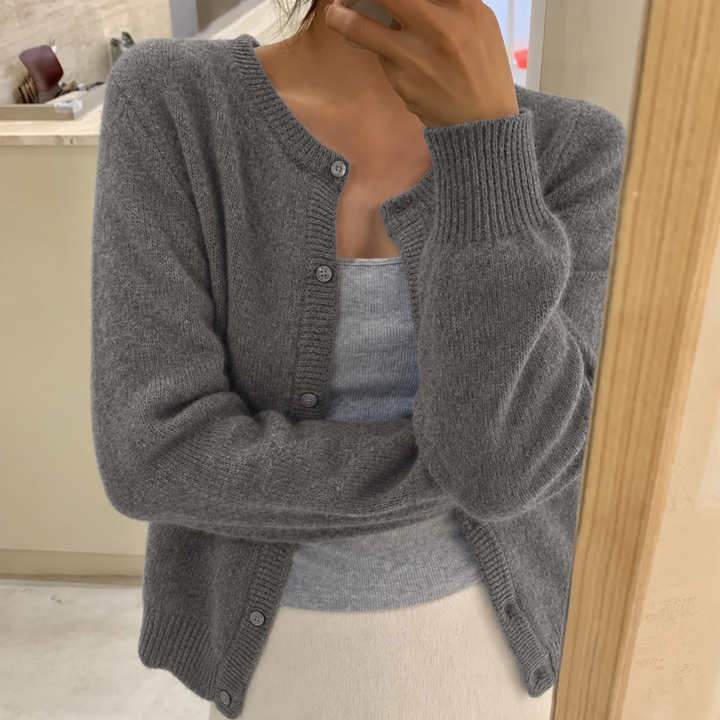 Grey soft-knit cardigan with button front, round neck, long sleeves, ribbed cuffs and hem